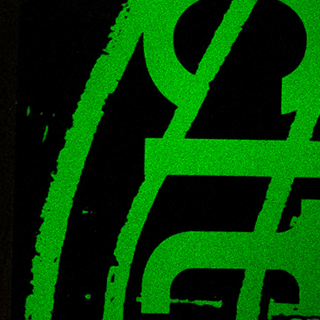 Close up of glowing, green letters.
